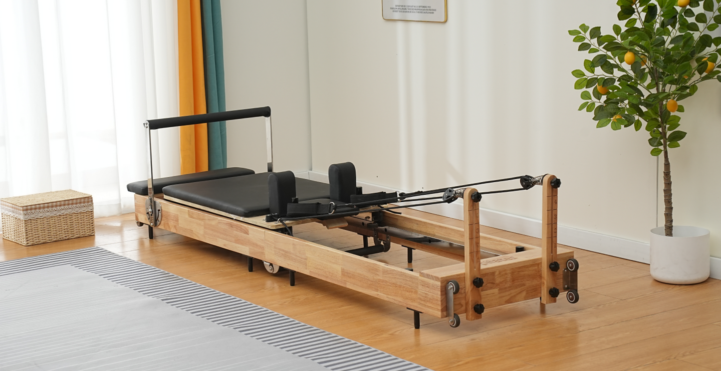 Vitalis handcrafted Pilates reformer The Haven unfolded with resistance straps